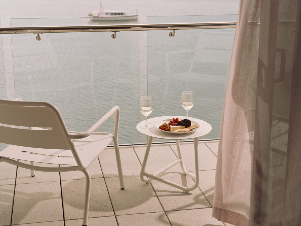 Ardo balcony view from ocean view room with cheese platter and wine.