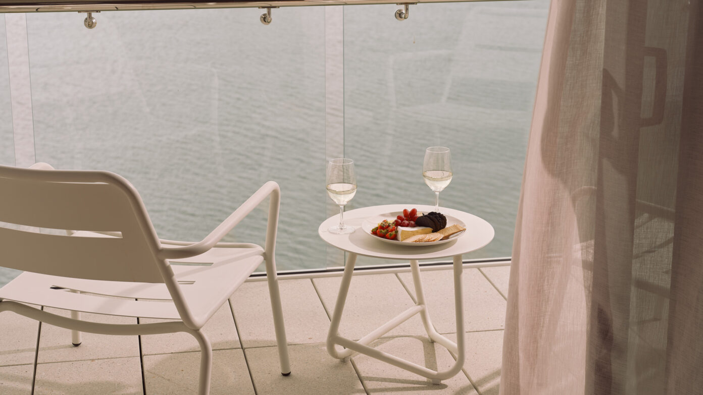 Ardo balcony view from ocean view room with cheese platter and wine.